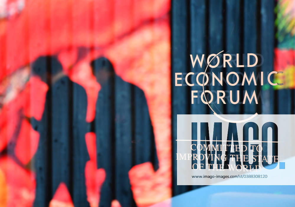KW02 Weltwirschaftsforum in Davos (240115) -- DAVOS, Jan. 15, 2024 -- People walk past the logo of the World Economic Forum (WEF) in Davos, Switzerland, Jan. 14, 2024. On the theme of Rebuilding Trust, the 54th WEF Annual Meeting will take place here from Jan. 15 to Jan. 19. The main topics at the forum range from achieving security and cooperation in a divided world, creating jobs and growth for a new era to a long-term strategy for climate, nature and energy. ) SWITZERLAND-DAVOS-WORLD ECONOMIC FORUM-PREPARATION LianxYi