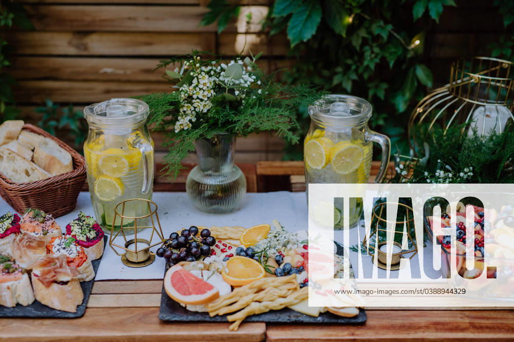 Close-up of dessert buffet at small wedding reception outside in the backyard. Close-up of a dessert buffet at small wedding reception outside in the backyard. model released