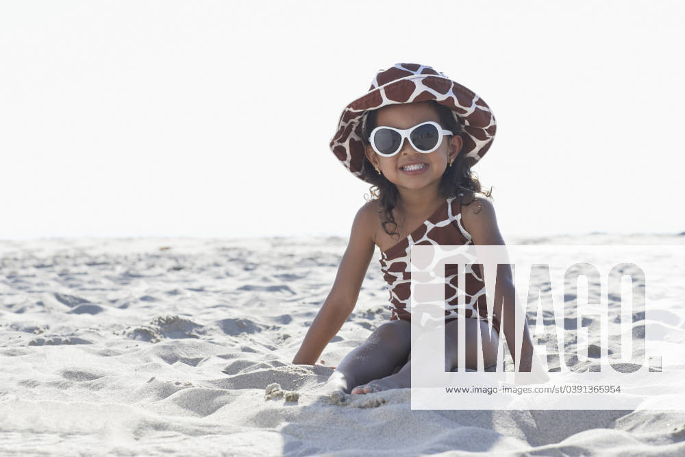 Young mixed race girl in sunglasses sitting at beach Venice Beach, CA, 21.12.2023, model released, TTBB_BLD068287.jpg, 2-3 years, african ethnicity, animal print, asian ethnicity, back lit, barefoot, bathing suit, beach, childhood, color image, confidence, copy space, cute, day, enjoying, fashion, front view, fun, getting away from it all, girl, glamour, happy, hat, horizontal, leisure activity, looking at camera, mixed race person, one girl only, one person, outdoors, people, photography, playfulness, portrait, posing, preschooler, recreation, sitting, smiling, summer, sunglasses, sunny, three quarter length, travel, vacation, weekend activities, minority, minoritiesaccessory, african, african american, african-american, afro american, af