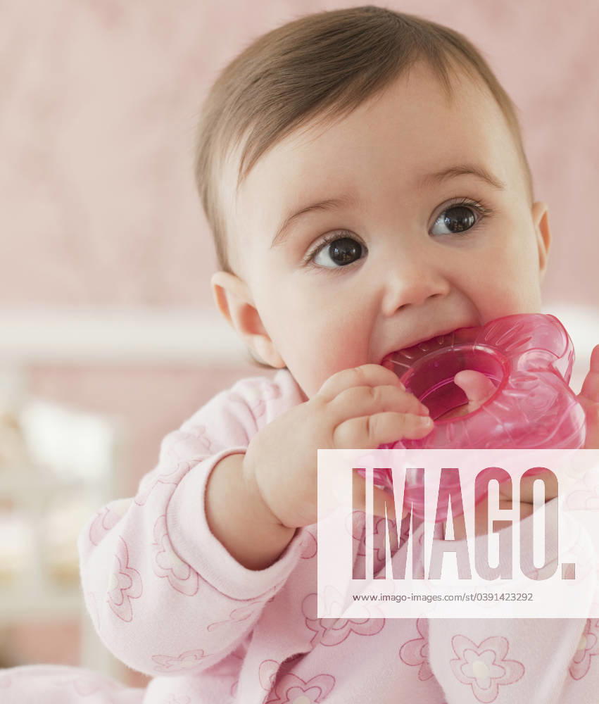Mixed race baby girl chewing on plastic toy Jersey City, NJ, 21.12.2023, model released, TTBB_BLD073614.jpg, 6-11 months, baby, baby girl, biting, childhood, close up, color image, curiosity, development, domestic life, growth, head and shoulders, holding, indoors, innocence, leisure activity, lifestyle, mixed race person, one baby girl only, one person, people, photography, pleasure, portrait, single object, teething, teething ring, toy, vertical, watching, minority, minoritiesadvancement, biter, child, children, close-up, closeup, color, colour, curious, delight, enjoyment, girl, gnawing, gratifying, head & shoulders, human, human being, indoor, inside, interest, juvenile, kid, leisure, leisure time, mixed race, naive, observing, one, pe