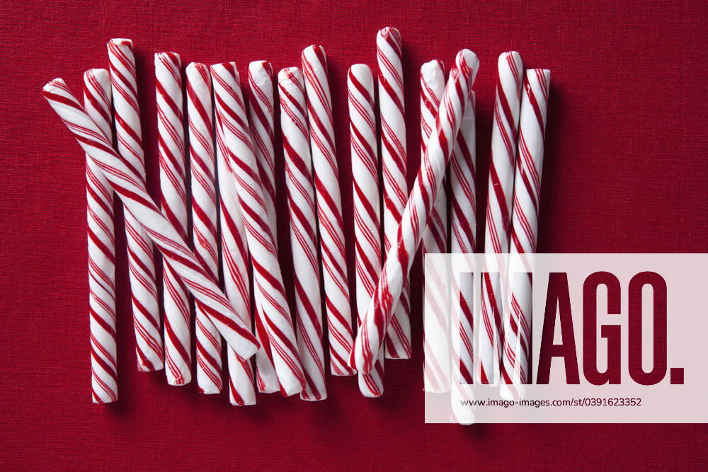 Row of candy canes Los Angeles, California, United States, 29.09.2010, TTBB_BLD084172.jpg, candy, candy cane, christmas, close up, color image, cut out, directly above, festive, food and drink, high angle view, holiday, horizontal, indulgence, large group of objects, nobody, peppermint, photography, red, red background, stick, still life, stripe, studio shot, sweet, temptation, together, tradition, treat, allure, celebration, cheerful, close-up, closeup, color, colour, culture, custom, cut-out, enticement, food, getaway, group, high angle, jolly, luxury, merry, mint, noel, seduction, silhouette, snack, still-life, streak, striate, studio, togetherness, traditional, vacation, vacationing, vegetation, x-mas, xmas, yule, yuletide,