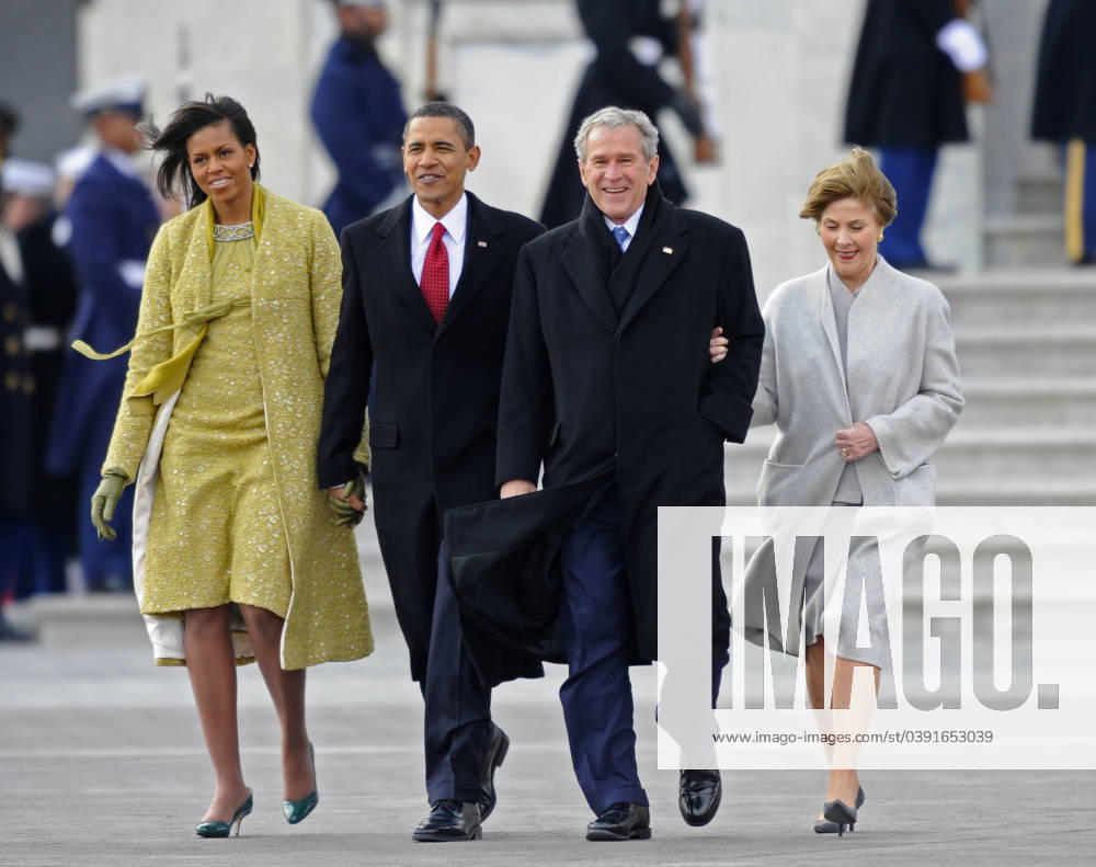 Bush and Cheney Departure Ceremony Washington, DC - January 20, 2009 -- Former United States President George W. Bush (2-R) and his wife Laura (R) are escorted to a waiting helicopter by President Barack Obama (2-L) and his wife Michelle as Bush departs from the U.S. Capitol after the swearing in of Obama as the 44th President of the United States during the 56th Presidential Inauguration ceremony in Washington, D.C., USA 20 January 2009..Credit: Tannen Maury - Pool via CNP Washington District of Columbia United States of America