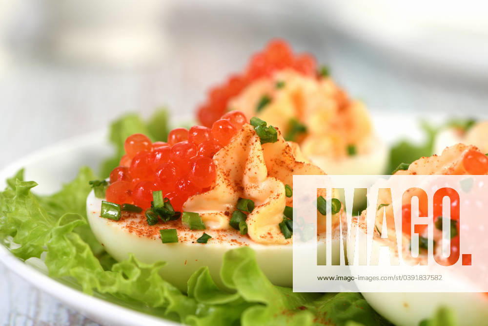 Stuffed eggs with salmon caviar Stuffed eggs with salmon caviar are a popular appetizer for any occasion. Elegantly decorated and expertly seasoned, they will always be a beautiful appetizer at a party.