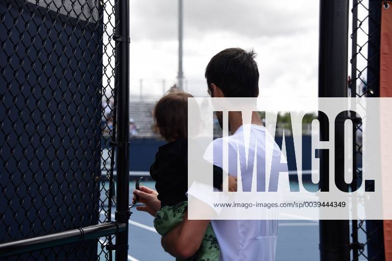 MIAMI GARDENS, FL - MARCH 20: Novak Djokovic greets a little fan, Jan Viloca after his practice during the Miami Open on March 20, 2019 at Hard Rock Stadium in Miami Gardens, FL.(Photo by Michele Sandberg Icon Sportswire) TENNIS: MAR 20 Miami Open Icon190320172