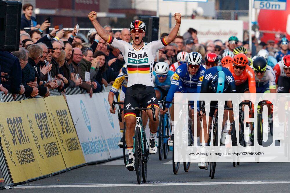KW12 German Pascal Ackermann of Bora-Hansgrohe (L) celebrates as he crosses the finish line to win, before Norwegian Kristoffer Halvorsen of Team Sky (R) and Colombian Alvaro Jose Hodeg of Deceuninck - Quick-Step (C) the sprint at the finish line to win the Bredene Koksijde Classic cycling race, Friday 22 March 2019, 197,5km in Koksijde. KURTxDESPLENTER x05554025x