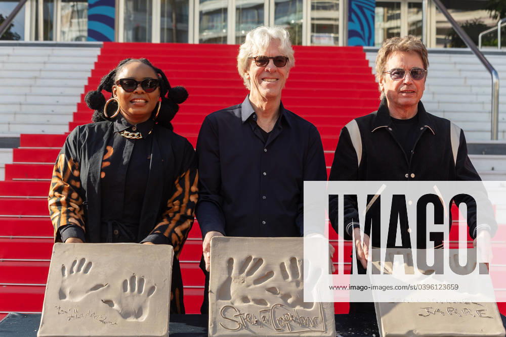 Handprint Ceremony Jean-Michel Jarre - Cannes (L to R) Yemi Alade, Stewart Copeland and Jean-Michel Jarre posing with their own handprints at handprinting ceremony on January 25, 2024 at the Palais des Festivals in Cannes during MIDEM event in Cannes, France. Photo by Cyril Chateau ABACAPRESS.COM Cannes Alpes-Maritimes France