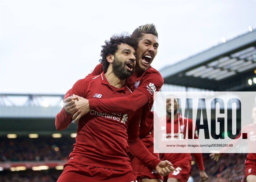 KW13 (190401) -- LIVERPOOL, April 1, 2019 (Xinhua) -- Liverpool s Mohamed Salah (L) celebrates with teammate Roberto Firmino after forcing an own-goal during the English Premier League match between Liverpool and Tottenham Hotspur at Anfield in Liverpool, Britain, on March 31, 2019. Liverpool won 2-1. (Xinhua) FOR . NOT FOR SALE FOR MARKETING OR ADVERTISING CAMPAIGNS. NO USE WITH UNAUTHORIZED AUDIO, VIDEO, DATA, FIXTURE LISTS, CLUB LEAGUE LOGOS OR LIVE SERVICES. ONLINE IN-MATCH USE LIMITED TO 45 IMAGES, NO VIDEO EMULATION. NO USE IN BETTING, GAMES OR SINGLE CLUB LEAGUE PLAYER PUBLICATIONS. (SP)BRITAIN-LIVERPOOL-FOOTBALL-ENGLISH PREMIER LEAGUE-LIVERPOOL VS TOTTENHAM HOTSPUR