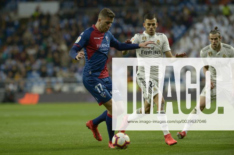 Madrid, Madrid, Spain - Dani Ceballos of Real Madrid fight the ball with Rivera of SD Huesca during a match between Real Madrid vs SD Huesca for La Copa del Rey at Santiago Bernabeu Stadium on March 31, 2019 in Madrid, Spain. Real Madrid CF v SD Huesca - La Liga - ZUMAn230 20190331_zaa_n230_965