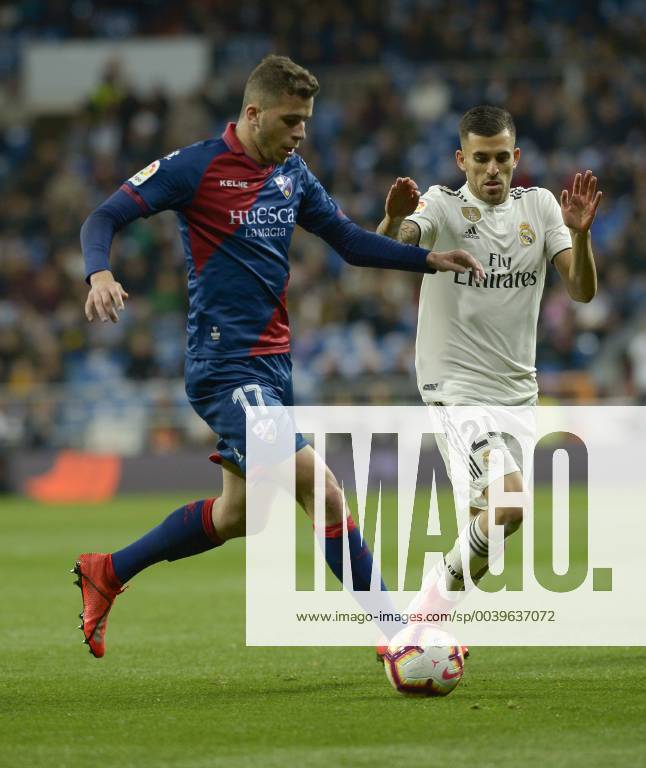 Madrid, Madrid, Spain - Dani Ceballos of Real Madrid fight the ball with Rivera of SD Huesca during a match between Real Madrid vs SD Huesca for La Copa del Rey at Santiago Bernabeu Stadium on March 31, 2019 in Madrid, Spain. Real Madrid CF v SD Huesca - La Liga - ZUMAn230 20190331_zaa_n230_966