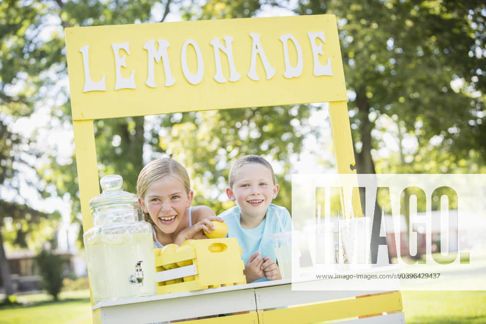 Caucasian brother and sister smiling at lemonade stand Lehi, Utah, USA, 17.09.2014, model released, TTBB_BLD142161.jpg, 4-5 years, 6-7 years, advertising, blonde hair, bonding, booth, boy, boys, brother, capitalism, caucasian, childhood, color image, commerce, consumerism, cup, day, earning, elementary age, enjoying, enterprise, entrepreneur, focus on foreground, food and drink, freshness, friend, front view, girl, girls, glassware, happy, head and shoulders, horizontal, initiative, innocence, leaning, lemon, lemonade, lemonade stand, lifestyle, merchandise, nature, offering, organic, outdoors, people, photography, pitcher, refreshing, retail, selling, sign, sister, small business, smiling, stand, standing, startup, straw, summer, sunny, s