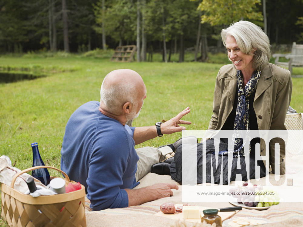 Older couple relaxing at picnic in park Accord, New York, USA, 21.12.2023, model released, TTBB_BLD170603.jpg, 55-59 years, 65-69 years, accord, aging, authentic, authenticity, beauty in nature, bonding, boyfriend, calm, caucasian, color image, conversation, copy space, day, drinking, eating, enjoying, environment, foliage, food and drink, forest, fruit, fun, gesturing, getting away from it all, girlfriend, grape, grass, happy, heterosexual couple, horizontal, husband, lawn, leisure activity, lifestyle, looking, looking down, love, man, mature adult, mature women, nature, new york, older, outdoors, park, peace, people, photography, picnic, picnic basket, picnic blanket, quality time, real people, recreation, relaxation, retirement, romance