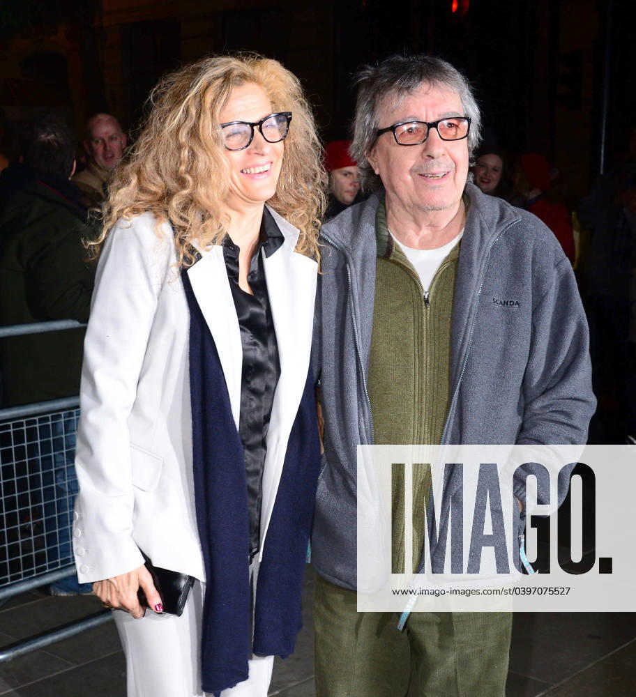 Bill Wyman and Suzanne Wyman attend a VIP private view of David Bailey s Stardust exhibition in London 112473, LONDON, UNITED KINGDOM - Monday February 3, 2014. Bill Wyman and Suzanne Wyman attend a VIP private view of David Bailey s Stardust exhibition in London. David Bailey: Bailey s Stardust, a major exhibition showcasing the work of acclaimed fashion photographer David Bailey, providing a retrospective of his career during which he has photographed stars including The Beatles, Andy Warhol and Jack Nicholson. , Credit:PacificCoastNews Avalon UK, London