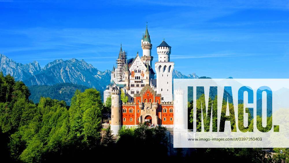Castle Neuschwanstein in the Sun and green Forest and blue Heaven, at Feet at Allgäu, Bavaria, Germany, Europe