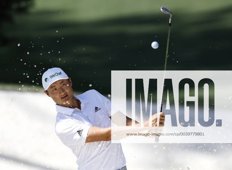 Li Haotong lines hits out of a bunker on the 10th green at practice on the Tuesday before the 2019 Masters Tournament at Augusta National Golf Club in Augusta, Georgia, on April 9, 2019. AUG20190409109 JOHNxANGELILLO