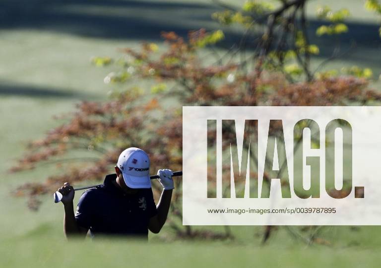 Satoshi Kodaira of Japan walks with his head down to the 13th green at practice on the Wednesday before the 2019 Masters Tournament at Augusta National Golf Club in Augusta, Georgia, on April 10, 2019. AUG20190410107 JOHNxANGELILLO