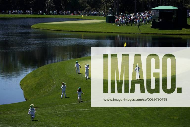 Children of Jason Day and Webb Simpson run to the 2nd green at the Par 3 Contest on the Wednesday before the 2019 Masters Tournament at Augusta National Golf Club in Augusta, Georgia, on April 10, 2019. AUG20190410737 JOHNxANGELILLO