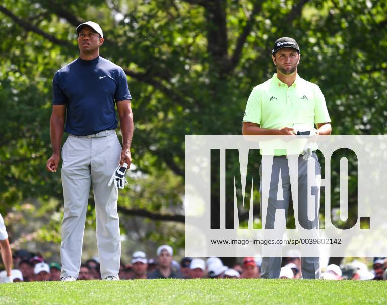 Tiger Woods (L) and Jon Rahm wait to hit off the 4th tee during the first round of the Masters Tournament at Augusta National Golf Club in Augusta, Georgia, on April 11, 2019. AUG20190411338 KEVINxDIETSCH