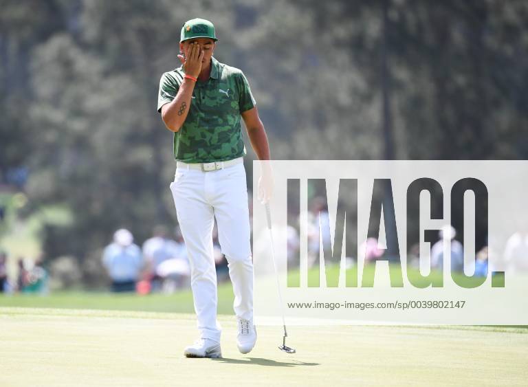 Rickie Fowler wipes his face on the 3rd green during the first round of the Masters Tournament at Augusta National Golf Club in Augusta, Georgia, on April 11, 2019. AUG20190411345 KEVINxDIETSCH