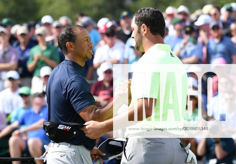Jon Rahm of Spain shakes hands with Tiger Woods on the 18th green in the first round at the 2019 Masters Tournament at Augusta National Golf Club in Augusta, Georgia, on April 11, 2019. AUG20190411811 KEVINxDIETSCH