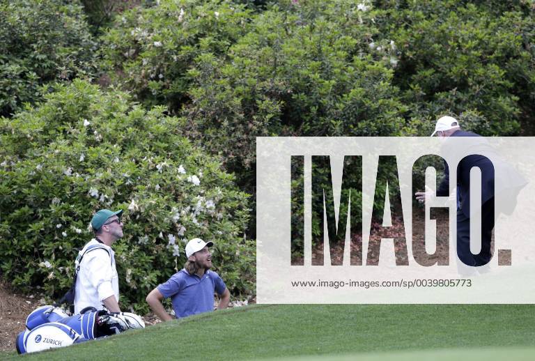 Tommy Fleetwood gets a ruling while standing in the area of Raes Creek on the 13th hole in the first round at the 2019 Masters Tournament at Augusta National Golf Club in Augusta, Georgia, on April 11, 2019. AUG20190411154 JOHNxANGELILLO