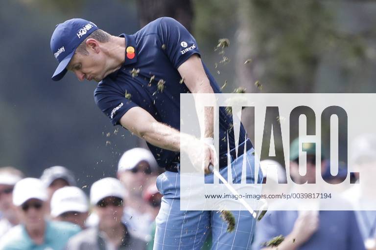 Justin Rose of the United Kingdom hits his approach shot to the first hole in the second round at the 2019 Masters Tournament at Augusta National Golf Club in Augusta, Georgia, on April 12, 2019. AUG20190412106 JOHNxANGELILLO
