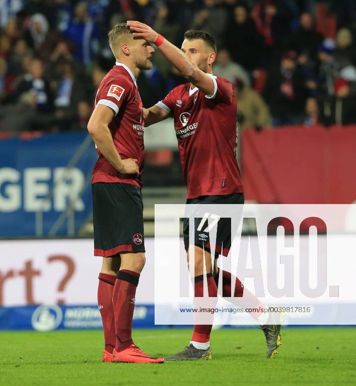 1 Bundesliga 1 FC Nuernberg vs. Schalke 04 Max Morlock Stadium Football Sport in picture Hanno Behrens 1 FC Nuernberg with Eduard Loewen 1 FC Nuernberg after invalid goal DFL REGULATIONS PROHIBIT ANY USE OF PHOTOGRAPHS AS IMAGE SEQUENCES AND OR QUASI VIDEO