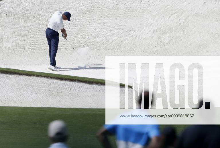 Tiger Woods hits out of a fairway bunker on the 8th hole in the second round at the 2019 Masters Tournament at Augusta National Golf Club in Augusta, Georgia, on April 12, 2019. AUG20190412122 JOHNxANGELILLO