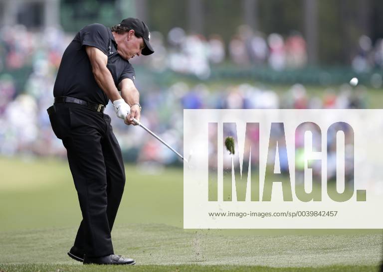 Phil Mickelson hits his approach shot to the 1st hole in the third round at the 2019 Masters Tournament at Augusta National Golf Club in Augusta, Georgia, on April 13, 2019. AUG20190413901 JOHNxANGELILLO