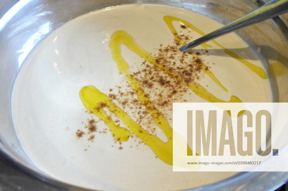 Homemade Tahini Paste food background Homemade tahini paste served in a bowel with olive oil and paprika. Tehina is a condiment made from toasted ground hulled sesame.
