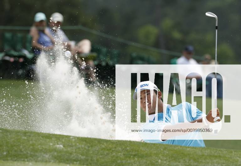 Golf: Masters Tournament Hideki Matsuyama of Japan hits a bunker shot on the 18th hole during the third round of the Masters Tournament at Augusta National Golf Club in Augusta, Georgia, on April 13, 2019.