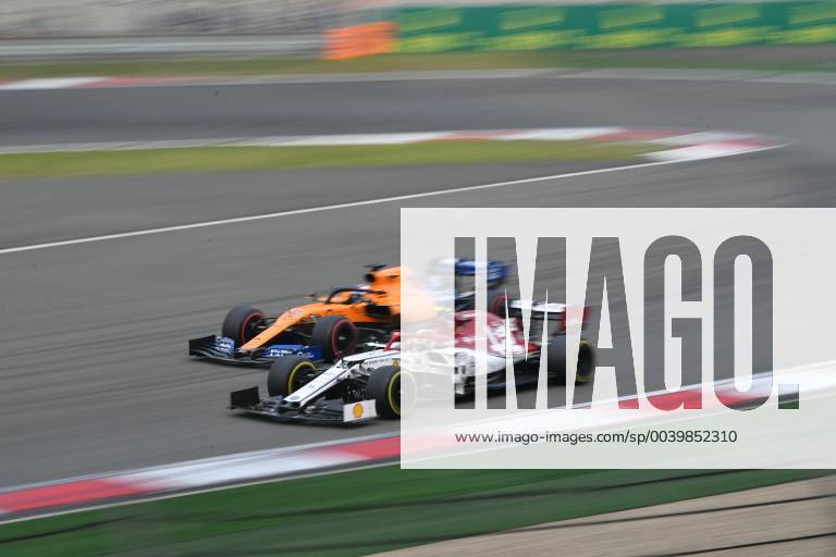 Italian Formula One driver Antonio Giovinazzi of Alfa Romeo Racing Ferrari, front, and Spanish Formula One driver Carlos Sainz compete in the Formula 1 Heineken Chinese Grand Prix 2019 at the Shanghai International Circuit in Shanghai, China, 14 April 2019. Lewis Hamilton wins landmark 1000th F1 race in Shanghai 20190414_503911