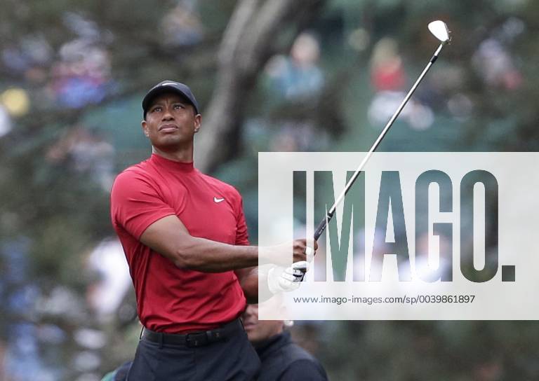 Tiger Woods hits his approach shot to the 1st hole in the final round at the 2019 Masters Tournament at Augusta National Golf Club in Augusta, Georgia, on April 14, 2019. AUG20190414901 JOHNxANGELILLO