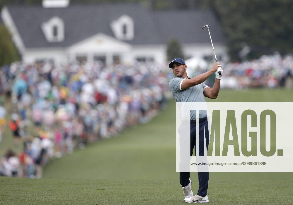 Brooks Koepka hits his approach shot to the 1st hole in the final round at the 2019 Masters Tournament at Augusta National Golf Club in Augusta, Georgia, on April 14, 2019. AUG20190414905 JOHNxANGELILLO