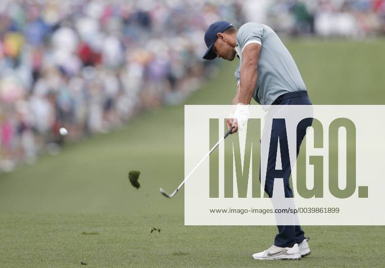 Brooks Koepka hits his approach shot to the 1st hole in the final round at the 2019 Masters Tournament at Augusta National Golf Club in Augusta, Georgia, on April 14, 2019. AUG20190414906 JOHNxANGELILLO