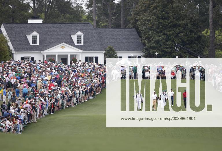 Francesco Molinari, Tiger Woods and Tony Finau walk to play a second shot after hitting their tee balls on the 1st hole in the final round at the 2019 Masters Tournament at Augusta National Golf Club in Augusta, Georgia, on April 14, 2019. AUG20190414908 JOHNxANGELILLO
