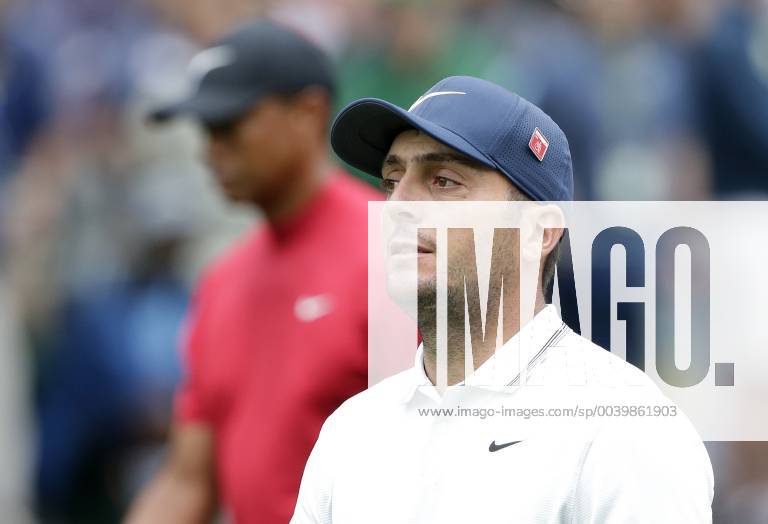 Francesco Molinari of Italy and Tiger Woods walk to play a second shot after hitting their tee balls on the 1st hole in the final round at the 2019 Masters Tournament at Augusta National Golf Club in Augusta, Georgia, on April 14, 2019. AUG20190414910 JOHNxANGELILLO