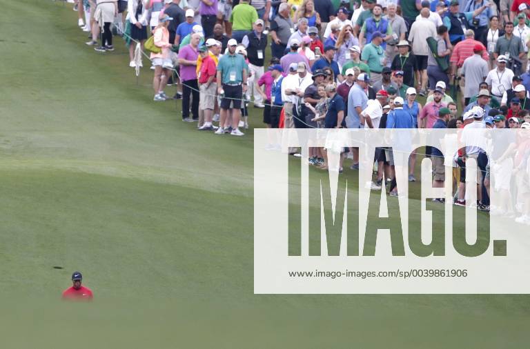 Tiger Woods walks to his ball on the first hole in the final round at the 2019 Masters Tournament at Augusta National Golf Club in Augusta, Georgia, on April 14, 2019. AUG20190414913 JOHNxANGELILLO