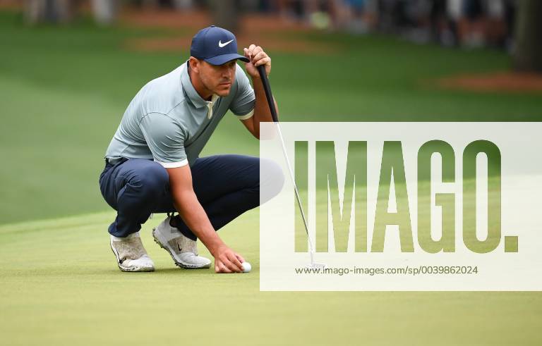 Brooks Koepka lines up a putt on the first green during the final round of the Masters Tournament at Augusta National Golf Club in Augusta, Georgia, on April 14, 2019. AUG20190414310 KEVINxDIETSCH