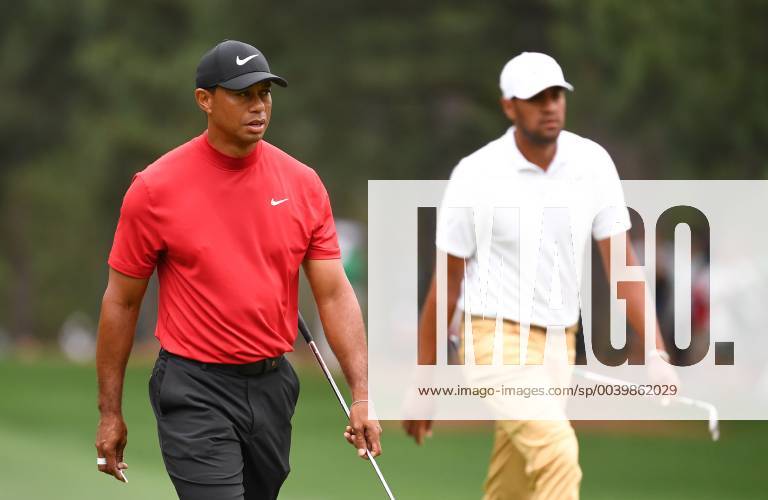 Tiger Woods walks with Tony Finau on the first fairway during the final round of the Masters Tournament at Augusta National Golf Club in Augusta, Georgia, on April 14, 2019. AUG20190414315 KEVINxDIETSCH