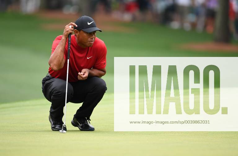Tiger Woods lines up a putt on the first green during the final round of the Masters Tournament at Augusta National Golf Club in Augusta, Georgia, on April 14, 2019. AUG20190414317 KEVINxDIETSCH