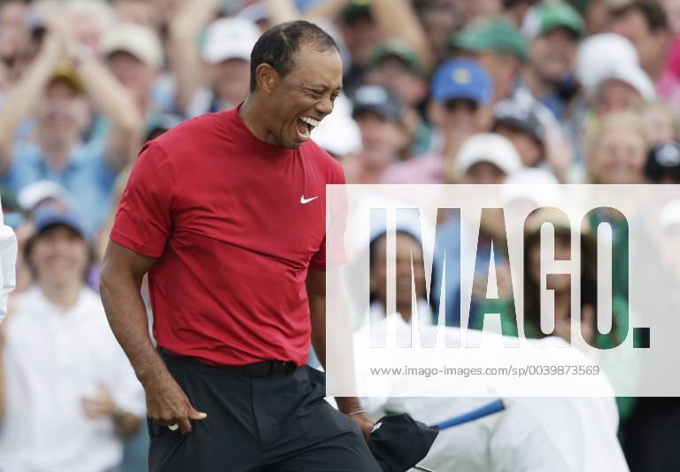 Tiger Woods celebrates on the 18th green in the final round at the 2019 Masters Tournament at Augusta National Golf Club in Augusta, Georgia, on April 14, 2019. Tiger Woods wins the Masters with a score of 13 under par for his 5th Green Jacket. AUG20190414916 JOHNxANGELILLO