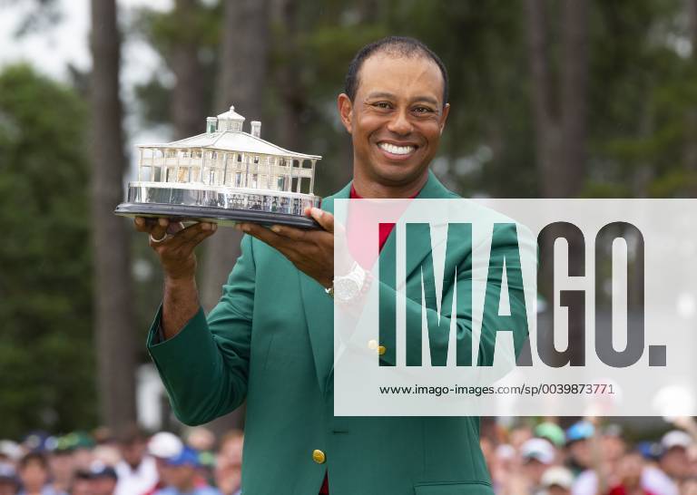 Tiger Woods holds the Masters Trophy wearing his newly won Green Jacket after the final round at the 2019 Masters Tournament at Augusta National Golf Club in Augusta, Georgia, on April 14, 2019. Tiger Woods wins the Masters with a score of 13 under par for his 5th Green Jacket. AUG20190414919 JOHNxANGELILLO