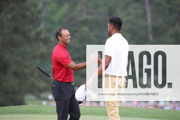 Tiger Woods (USA) shakes hands with Tony Finau on the 18th hole during the final round of the 2019 Masters golf tournament at the Augusta National Golf Club in Augusta, Georgia, United States, on April 14, 2019. Noxthirdxpartyxsales (101271187)