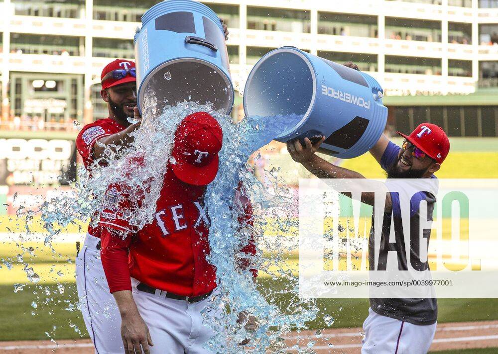 Arlington, TX, USA - Texas Rangers Nomar Mazara and Rougned Odor shower pitcher Shawn Kelley with sports drink after he struck out Robinson Chirinos for the final out and save in the 11-10 win over the Houston Astros on Sunday, April 21, 2019 in Arlington, Texas. Houston Astros vs. Texas Rangers - ZUMAm67_ 20190421_zaf_m67_048