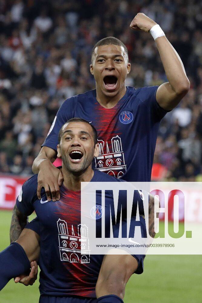 KW16 (190422) -- PARIS, April 22, 2019 (Xinhua) -- Paris St Germain s Kylian Mbappe (top) and Dani Alves celebrate after the Ligue 1 match between Paris Saint Germain and AS Monaco in Paris, France, on April 21, 2019. PSG beat AS Monaco 3-1 claiming the title of champion of 2018-2109 Ligue 1 . (Xinhua Jack Chan) (SP)FRANCE-PARIS-FOOTBALL-LIGUE 1-PSG VS MONACO
