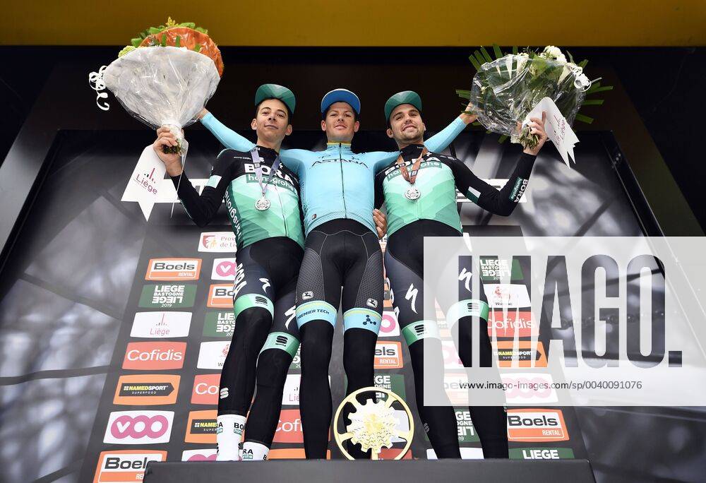 KW17 Danish Jakob Fuglsang of Astana Pro Team, Italian Davide Formolo of Bora-Hansgrohe and German Maximilian Schachmann of Bora-Hansgrohe celebrate on the podium after the 105th edition of the Liege-Bastogne-Liege one day cycling race, Sunday 28 April 2019, 258 km, in Liege. ERICxLALMAND x05575684x