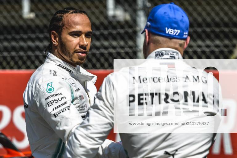 Barcelona, Catalonia, Spain - LEWIS HAMILTON (GBR) from team Mercedes congratulates his team mate VALTTERI BOTTAS (FIN) from team Mercedes to his pole after the qualifying session of the Spanish GP at Circuit de Catalunya F1 2019: Spanish Grand Prix: Pole Position. - ZUMAo105 20190511_zap_o105_069