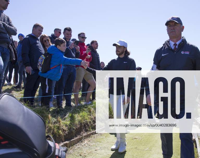 11th May 2019, Hillside Golf Club, Southport, England; Betfred British Masters, hosted by Tommy Fleetwood, day 3; Tommy Fleetwood (ENG) shakes hands with a young golf fan on his way to the tee at the 7th hole ActionPlus12133920 DavidxBlunsden
