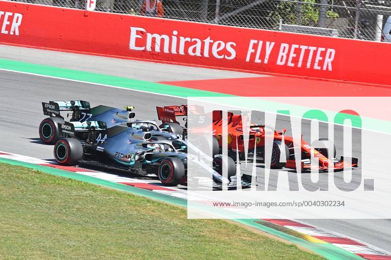 FIA Formula 1 Grand Prix of Spain 2019 race Start to the race Lewis Hamilton Mercedes AMG Petronas presses inside Valtteri Bottas Mercedes AMG Petronas middle and Sebastian Vettel Ferrari outside past Barcelona eel-fotografie Eberhard Krieger