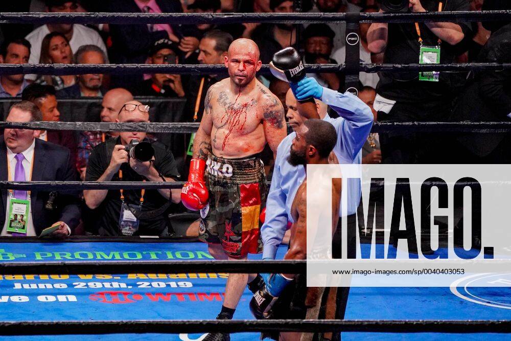 Brooklyn, New York, USA - KIKO MARTINEZ watches the referee raise GARY RUSSELL, JR.s hand in victory after the ring doctor stopped their WBC World Featherweight Championship bout at the Barclays Center in Brooklyn, New York. Boxing 2019 - Gary Russell Jr. Defeats Kiko Martinez by 5th Round TKO - ZUMAp109 20190518_zaf_p109_007